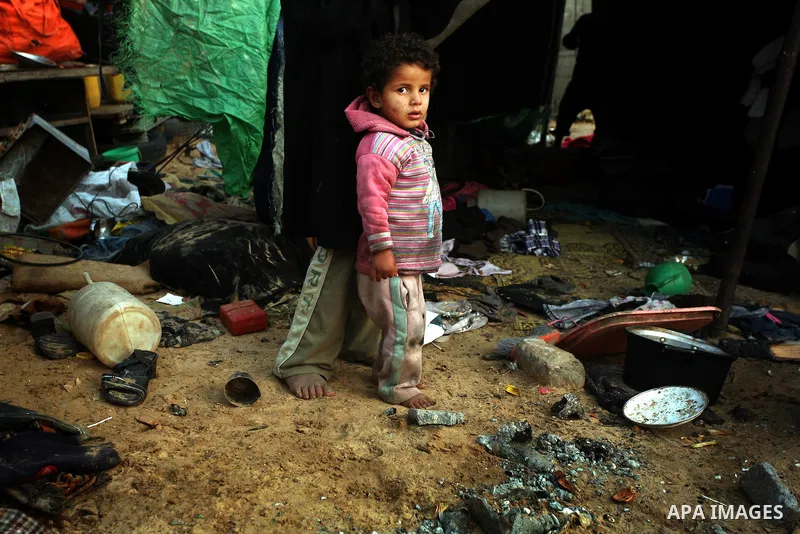Palestinian children, from a Bedouin family, paly during low winter temperatures inside their family's tent in Gaza's Zeitoun neighbourhood January 31, 2012. Photo by Mahmud Nassar