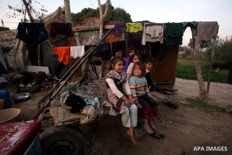 Palestinian children, from a Bedouin family, paly during low winter temperatures inside their family's tent in Gaza's Zeitoun neighbourhood January 31, 2012. Photo by Mahmud Nassar