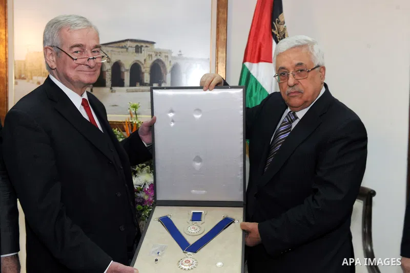 Palestinian President, Mahmoud Abbas (Abu Mazen), gives the German Professor Siegfried Vogel, Medal of Merit and Excellence, in the West Bank city of Ramallah on Jan. 31, 2012. photo by Thaer Ganaim