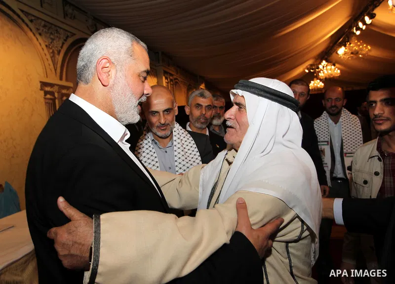 Palestinian Prime Minister in Gaza Strip, Ismail Haniyah receives released prisoners, deported to the Qatar, in the Qatari capital of Doha on Jan. 31,2012. photo by Mohammed Al-Ostaz