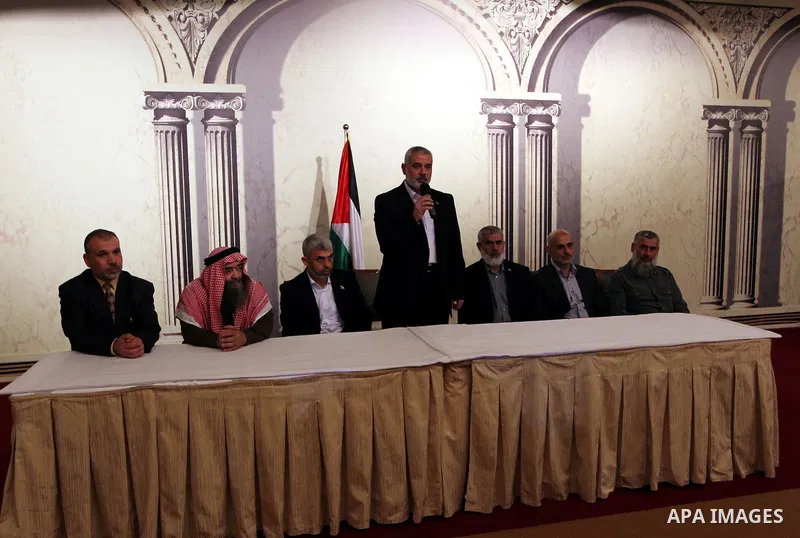 Palestinian Prime Minister in Gaza Strip, Ismail Haniyah receives released prisoners, deported to the Qatar, in the Qatari capital of Doha on Jan. 31,2012. photo by Mohammed Al-Ostaz