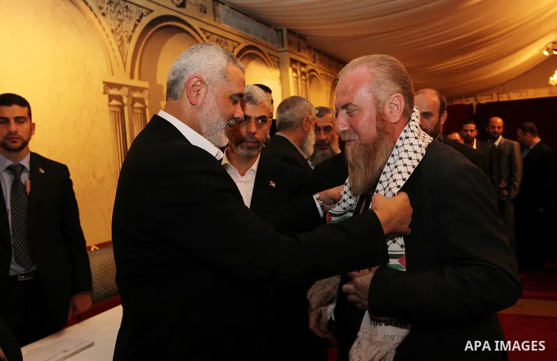 Palestinian Prime Minister in Gaza Strip, Ismail Haniyah receives released prisoners, deported to the Qatar, in the Qatari capital of Doha on Jan. 31,2012. photo by Mohammed Al-Ostaz
