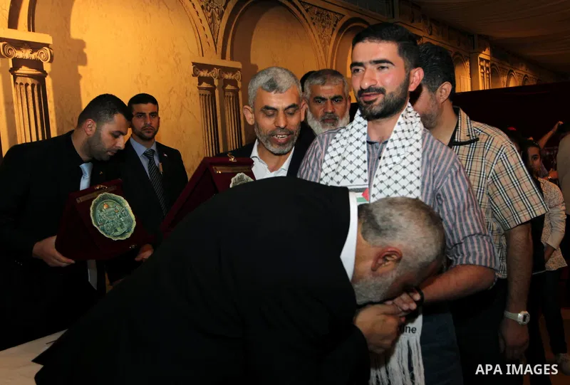 Palestinian Prime Minister in Gaza Strip, Ismail Haniyah receives released prisoners, deported to the Qatar, in the Qatari capital of Doha on Jan. 31,2012. photo by Mohammed Al-Ostaz