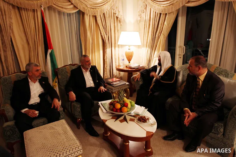 Palestinian Prime Minister in Gaza Strip, Ismail Haniyah meets with Secretary General of the International Union for Muslims Scholars Dr. Ali Mohi El-dein Qara Daghi in the Qatari capital of Doha on Jan. 31,2012. Photo b...