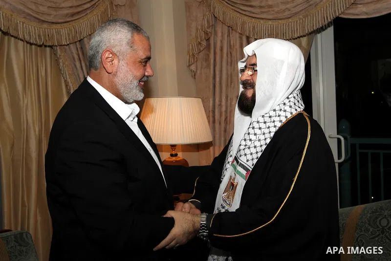 Palestinian Prime Minister in Gaza Strip, Ismail Haniyah meets with Secretary General of the International Union for Muslims Scholars Dr. Ali Mohi El-dein Qara Daghi in the Qatari capital of Doha on Jan. 31,2012. Photo b...
