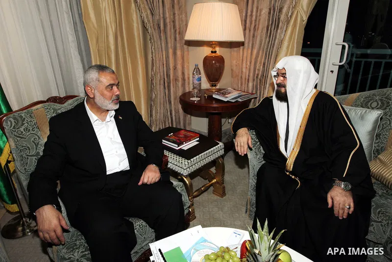 Palestinian Prime Minister in Gaza Strip, Ismail Haniyah meets with Secretary General of the International Union for Muslims Scholars Dr. Ali Mohi El-dein Qara Daghi in the Qatari capital of Doha on Jan. 31,2012. Photo b...