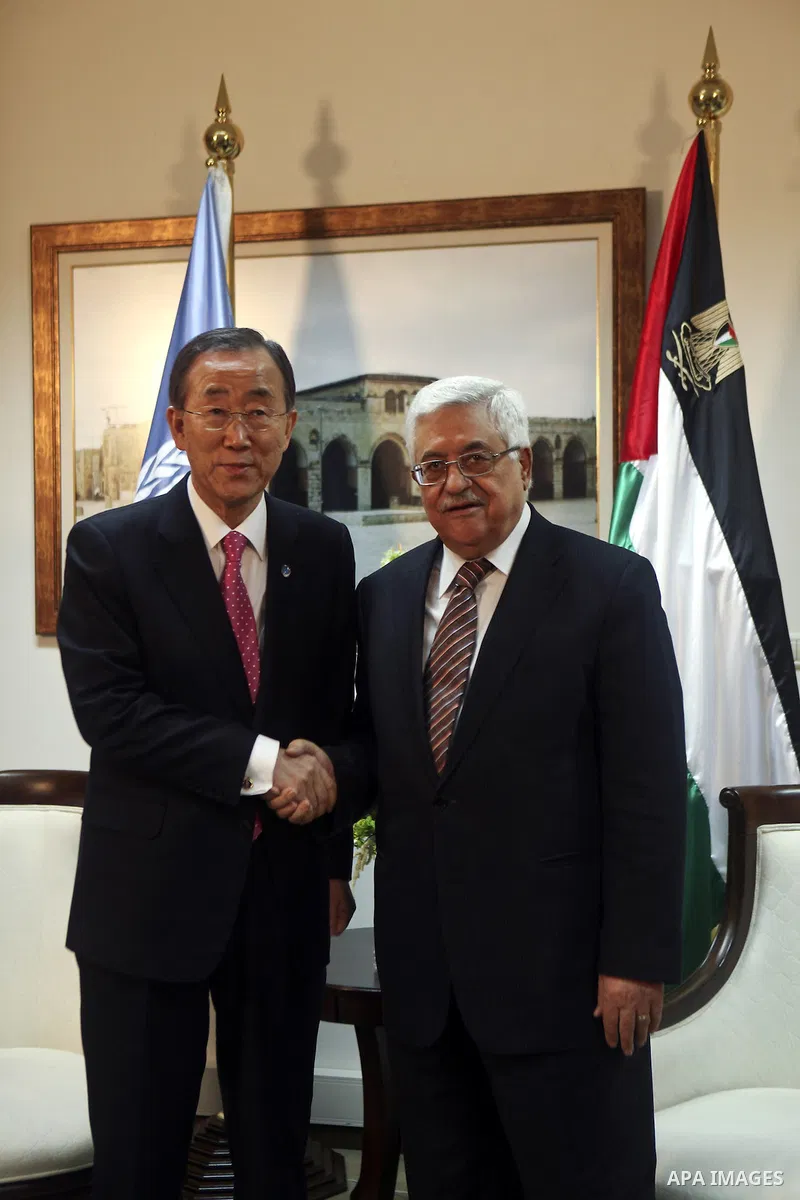 Palestinian President Mahmoud Abbas, shakes hands with U.N. Secretary-General Ban Ki-moon during their meeting in the West Bank city of Ramallah on Feb. 01, 2012. photo by Issam Rimawi