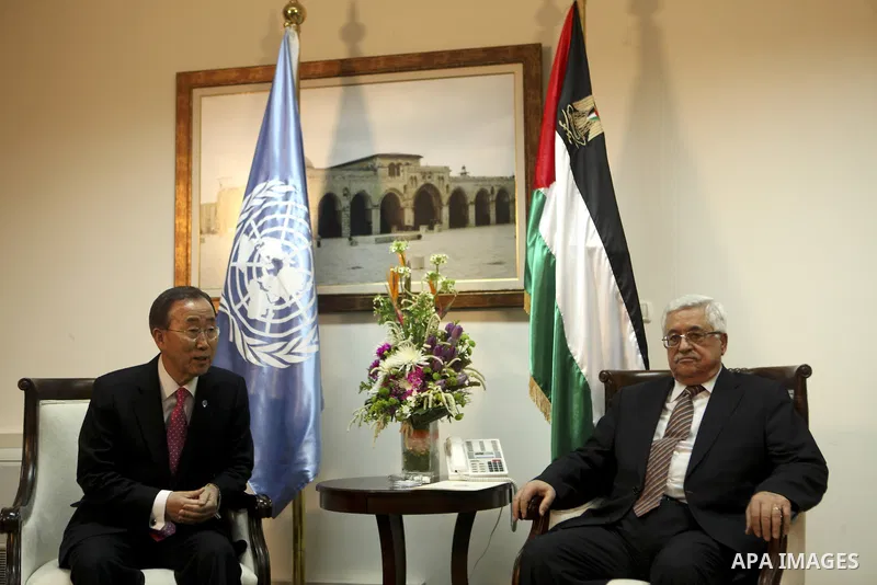 Palestinian President Mahmoud Abbas, shakes hands with U.N. Secretary-General Ban Ki-moon during their meeting in the West Bank city of Ramallah on Feb. 01, 2012. photo by Issam Rimawi