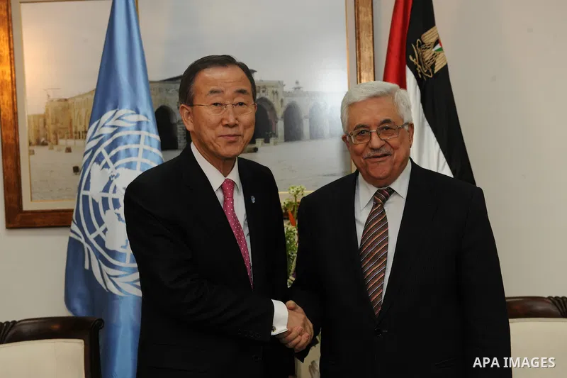 Palestinian President Mahmoud Abbas (R) shakes hands with U.N. Secretary-General Ban Ki-moon (L) during their meeting in the West Bank city of Ramallah on Feb. 1, 2012. Photo by Thaer Ghanaim