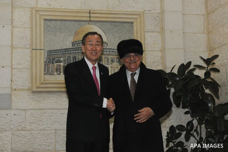 Palestinian President Mahmoud Abbas (R) shakes hands with U.N. Secretary-General Ban Ki-moon (L) during their meeting in the West Bank city of Ramallah on Feb. 1, 2012. Photo by Thaer Ghanaim