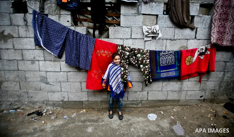 Palestinian children play in front of their house Al Shate` refugee camp in the west of Gaza City, on Feb. 02, 2012. Photo by Ali Jadallah