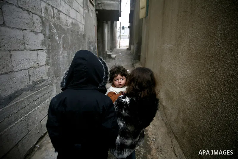 Palestinian children play in front of their house Al Shate` refugee camp in the west of Gaza City, on Feb. 02, 2012. Photo by Ali Jadallah