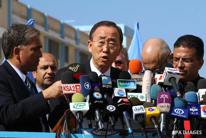 UN secretary general Ban Ki-moon speaks during a press conference as he visits the construction site of a housing project in Khan Yunis in the southern Gaza Strip on February 2, 2012. Protesters threw shoes, sand and sma...