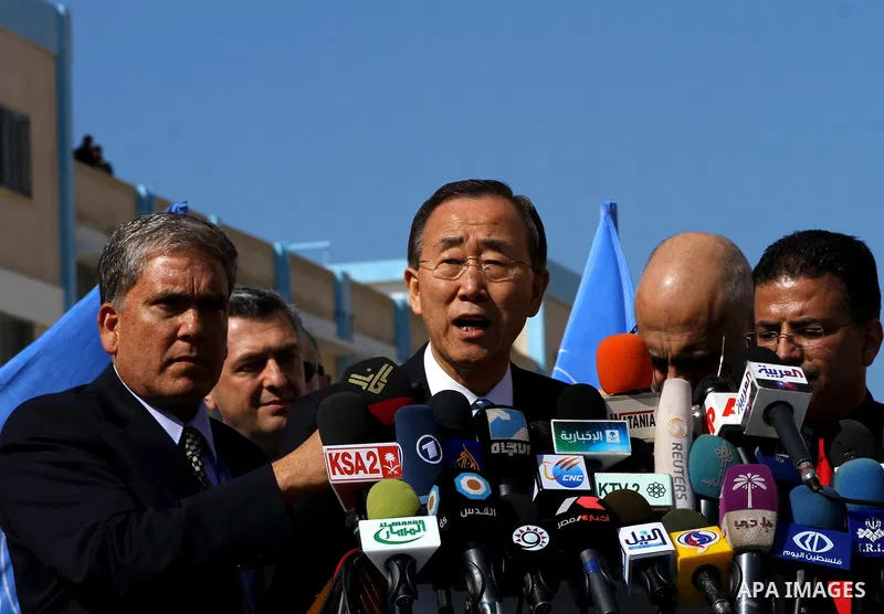 UN secretary general Ban Ki-moon speaks during a press conference as he visits the construction site of a housing project in Khan Yunis in the southern Gaza Strip on February 2, 2012. Protesters threw shoes, sand and sma...