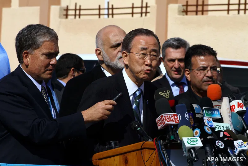 UN secretary general Ban Ki-moon speaks during a press conference as he visits the construction site of a housing project in Khan Yunis in the southern Gaza Strip on February 2, 2012. Protesters threw shoes, sand and sma...