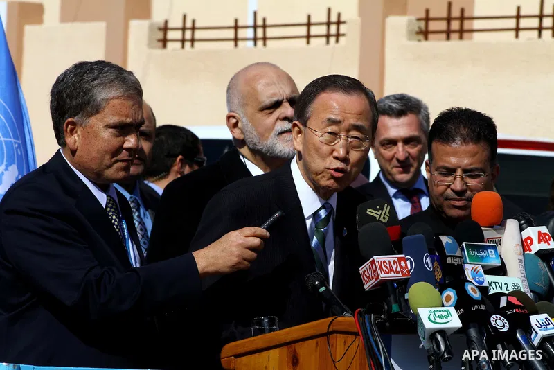 UN secretary general Ban Ki-moon speaks during a press conference as he visits the construction site of a housing project in Khan Yunis in the southern Gaza Strip on February 2, 2012. Protesters threw shoes, sand and sma...