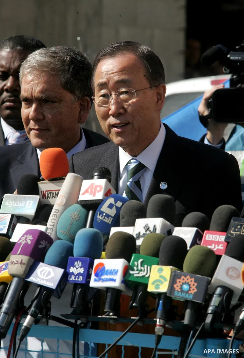UN secretary general Ban Ki-moon speaks during a press conference as he visits the construction site of a housing project in Khan Yunis in the southern Gaza Strip on February 2, 2012. Protesters threw shoes, sand and sma...