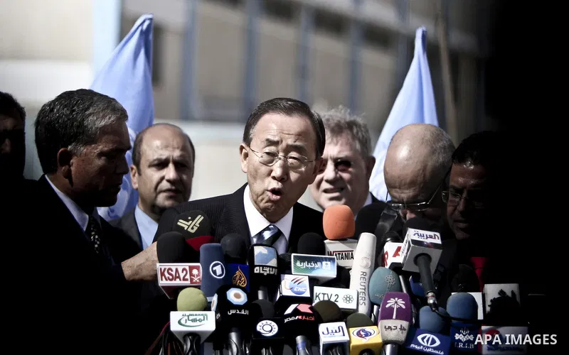 UN secretary general Ban Ki-moon speaks during a press conference as he visits the construction site of a housing project in Khan Yunis in the southern Gaza Strip on February 2, 2012. Protesters threw shoes, sand and sma...