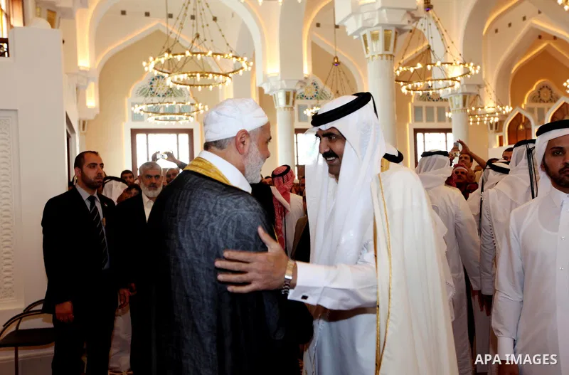 Palestinian Prime Minister in Gaza Strip, Ismail Haniyah, meets with the Qatari Emir Sheikh Hamad bin Khalifa Al Thani during Friday prayers in the mosque of Muhammad ibn Abed al-Wahhab in the Qatari capital of Doha on F...