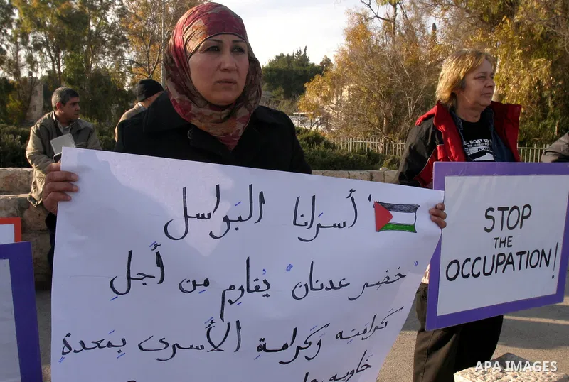 Palestinian, foreign and Israeli left-wing activists participate in a demonstration in the east Jerusalem neighborhood of Sheikh Jarrah, Friday, Feb. 03, 2012. The protest was organized by groups supporting Palestinians...