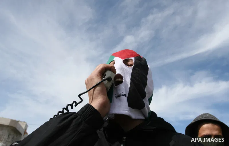 A Palestinian demonstrator takes part in a weekly protest against the construction of Israel's controversial separation barrier and the expansion of Jewish settlements in the West Bank village of Nabi Saleh near Ramallah...