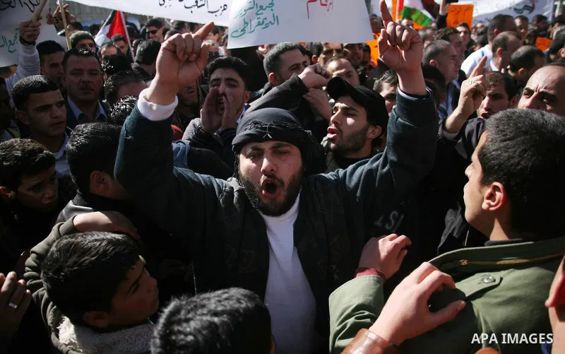Palestinians protest against rising prices and taxes in the West Bank city of Hebron. Saturday, Feb. 4, 2012. Palestinian Authority Prime Minister Salam Fayyad has sparked a furor with a push to get Palestinians to pay m...