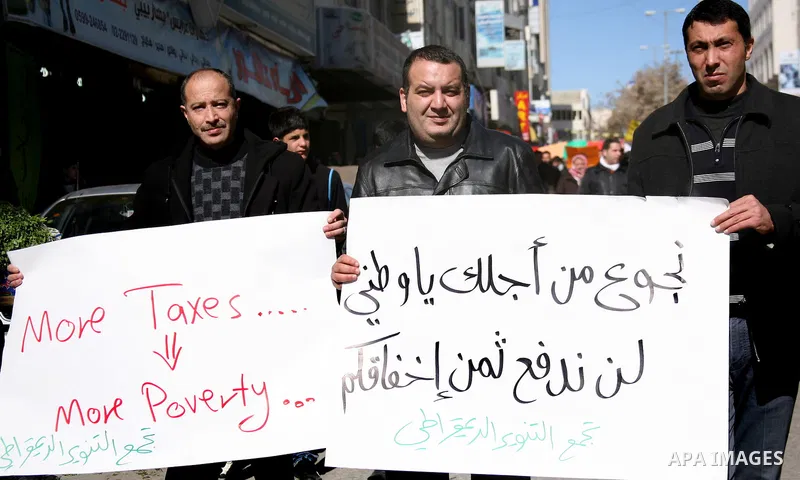 Palestinians protest against rising prices and taxes in the West Bank city of Hebron. Saturday, Feb. 4, 2012. Palestinian Authority Prime Minister Salam Fayyad has sparked a furor with a push to get Palestinians to pay m...