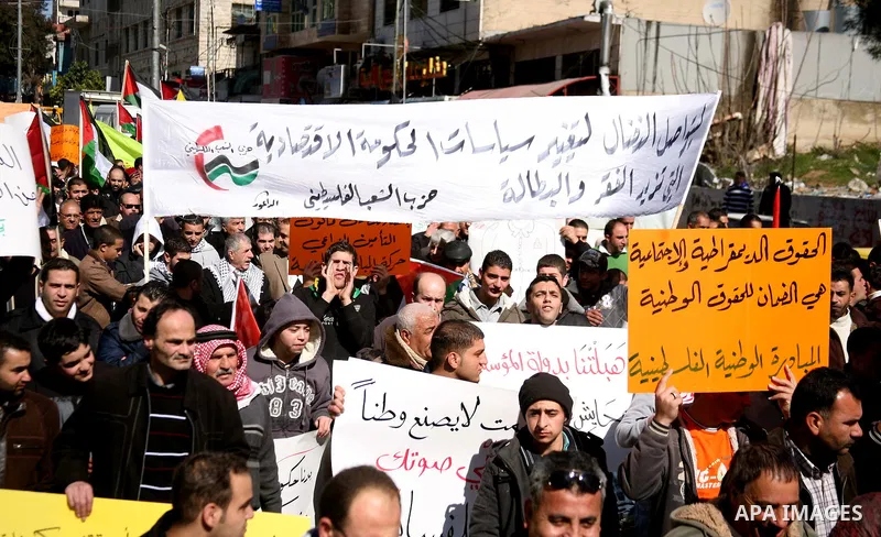 Palestinians protest against rising prices and taxes in the West Bank city of Hebron. Saturday, Feb. 4, 2012. Palestinian Authority Prime Minister Salam Fayyad has sparked a furor with a push to get Palestinians to pay m...