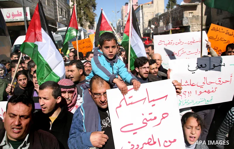 Palestinians protest against rising prices and taxes in the West Bank city of Hebron. Saturday, Feb. 4, 2012. Palestinian Authority Prime Minister Salam Fayyad has sparked a furor with a push to get Palestinians to pay m...