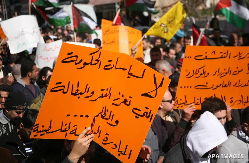 Palestinians protest against rising prices and taxes in the West Bank city of Hebron. Saturday, Feb. 4, 2012. Palestinian Authority Prime Minister Salam Fayyad has sparked a furor with a push to get Palestinians to pay m...