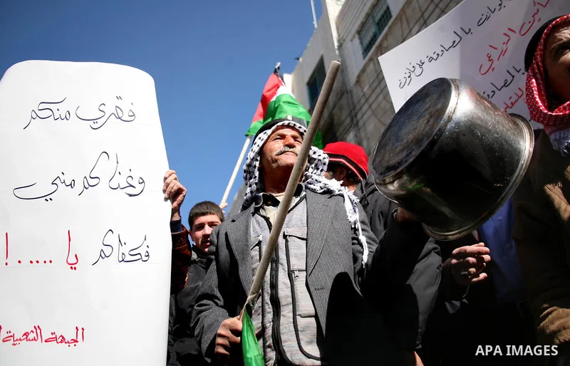 Palestinians protest against rising prices and taxes in the West Bank city of Hebron. Saturday, Feb. 4, 2012. Palestinian Authority Prime Minister Salam Fayyad has sparked a furor with a push to get Palestinians to pay m...