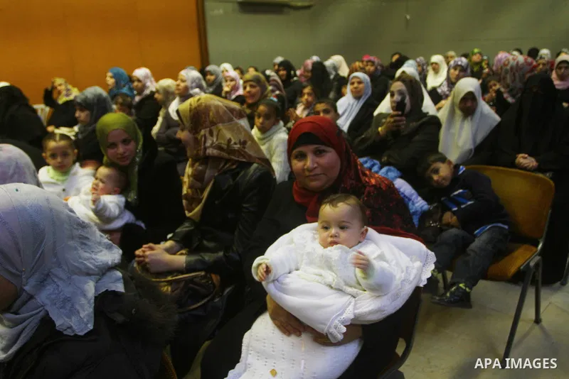 Palestinians attend a festival marking the birthday of Prophet Mohammad in Gaza City February 4, 2012.Photo by Ashraf Amra
