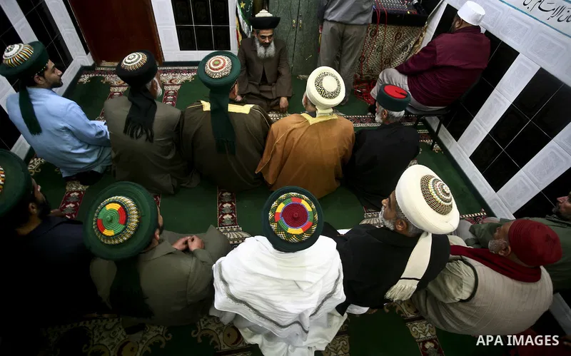 Members of a palestinian Sufi Muslim group play traditional instruments during the birthday of Prophet Mohammad, in Al-Nusirat refugee camp on 04 February 2012. Muslims across the world celebrated the birth of the Prophe...
