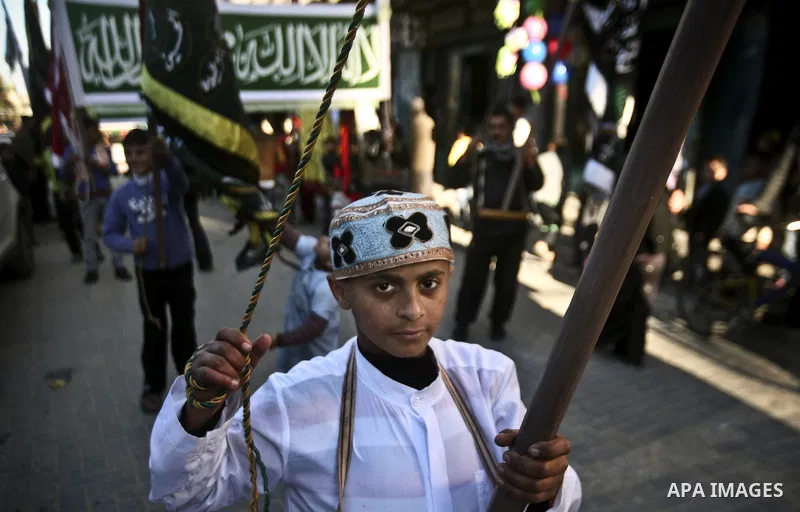 Members of a palestinian Sufi Muslim group play traditional instruments during the birthday of Prophet Mohammad, in Al-Nusirat refugee camp on 04 February 2012. Muslims across the world celebrated the birth of the Prophe...