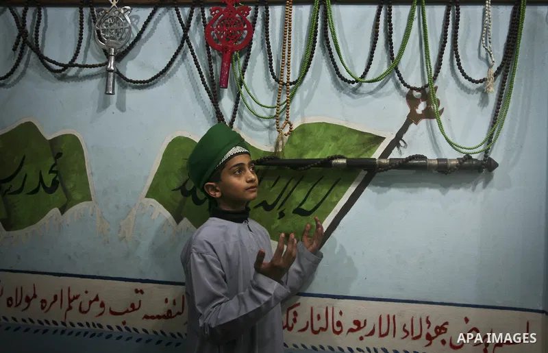 Members of a palestinian Sufi Muslim group play traditional instruments during the birthday of Prophet Mohammad, in Al-Nusirat refugee camp on 04 February 2012. Muslims across the world celebrated the birth of the Prophe...