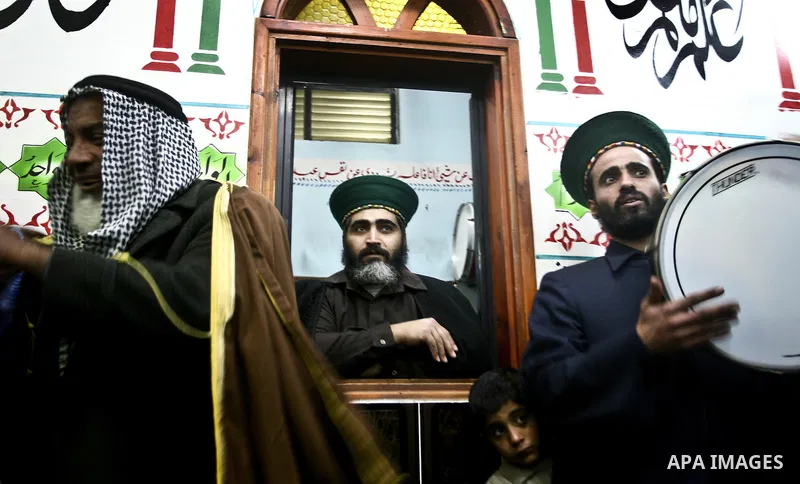 Members of a palestinian Sufi Muslim group play traditional instruments during the birthday of Prophet Mohammad, in Al-Nusirat refugee camp on 04 February 2012. Muslims across the world celebrated the birth of the Prophe...