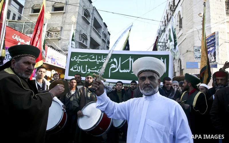 Members of a palestinian Sufi Muslim group play traditional instruments during the birthday of Prophet Mohammad, in Al-Nusirat refugee camp on 04 February 2012. Muslims across the world celebrated the birth of the Prophe...
