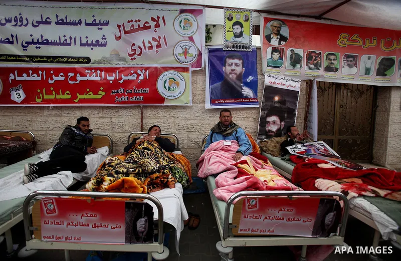 Palestinians participate a hunger strike, in solidarity with the prisoners in Israeli jails as they gather in a weekly activity calling for their liberty at the Red Cross headquarters. 6th February 2012. Photo by Ashraf...