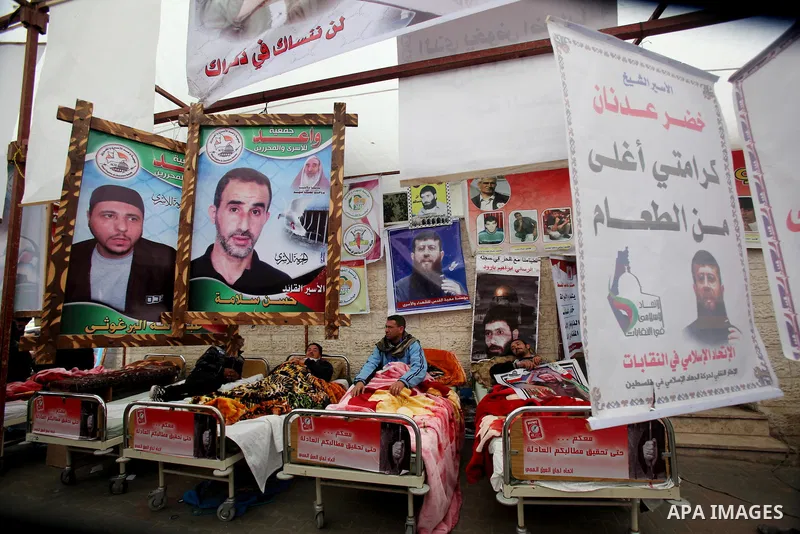Palestinians participate a hunger strike, in solidarity with the prisoners in Israeli jails as they gather in a weekly activity calling for their liberty at the Red Cross headquarters. 6th February 2012. Photo by Ashraf...