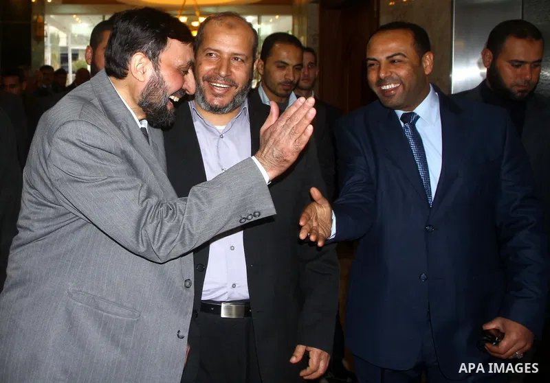 A Palestinian member of Hamas movement political bureau, Emad Al-Alami is welcomed by Hamas movement leaders and others after his arrival to Gaza Strip, in Gaza city on Feb. 6,2012. Al-Almi returned to Gaza Strip on Mond...