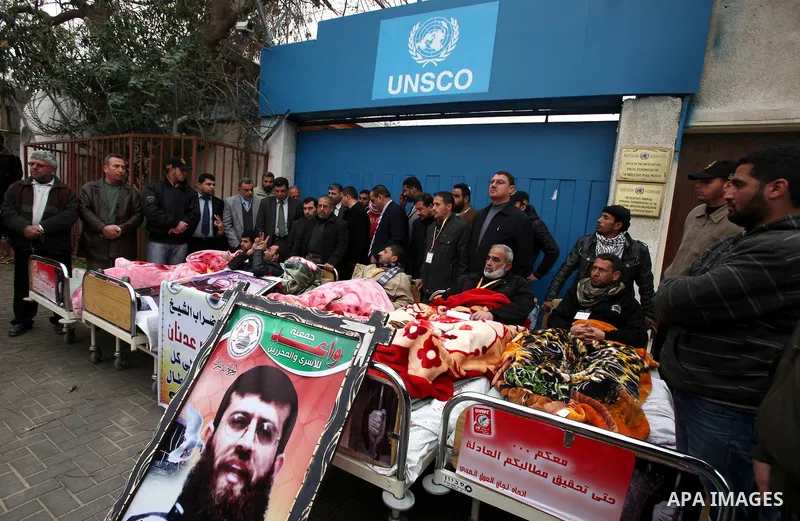 Palestinians on a hunger strike in solidarity with the prisoners in Israeli jails in front of the UN headquarters in Gaza City, on Feb. 07, 2012. Photo by Ashraf Amra