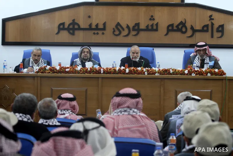 The spokesman of the Palestinian parliament, Ahmed Bahr meets with members of the "Miles of Smiles 9" aid convoy at the parliament headquarters in Gaza city on Feb. 07, 2012. The convoy, carrying medical aid for the Pale...