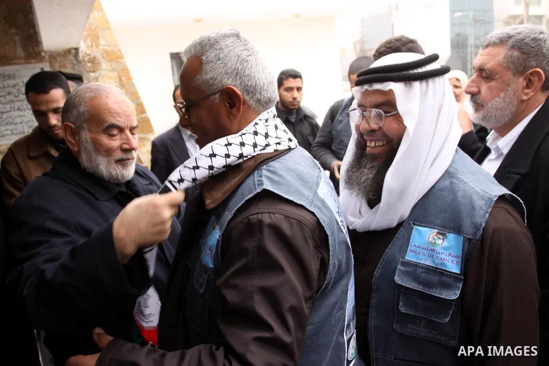 The spokesman of the Palestinian parliament, Ahmed Bahr meets with members of the "Miles of Smiles 9" aid convoy at the parliament headquarters in Gaza city on Feb. 07, 2012. The convoy, carrying medical aid for the Pale...