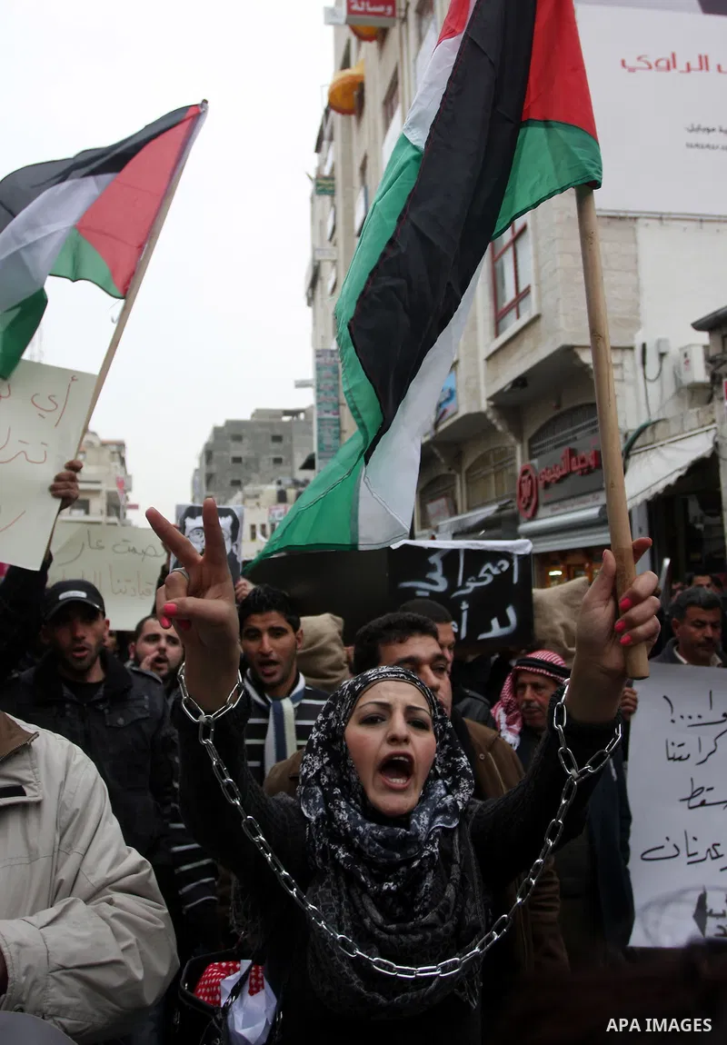 Palestinians demonstrate in solidarity with Khader Adnan, a senior member of Islamic Jihad jailed in Israel, who has been on a hunger strike for over seven weeks, during a protest in the West Bank city of Ramallah, Tuesd...