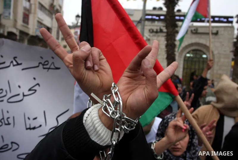 Palestinians demonstrate in solidarity with Khader Adnan, a senior member of Islamic Jihad jailed in Israel, who has been on a hunger strike for over seven weeks, during a protest in the West Bank city of Ramallah, Tuesd...