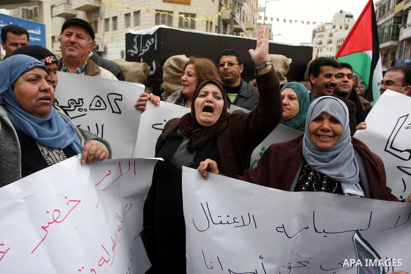 Palestinians demonstrate in solidarity with Khader Adnan, a senior member of Islamic Jihad jailed in Israel, who has been on a hunger strike for over seven weeks, during a protest in the West Bank city of Ramallah, Tuesd...