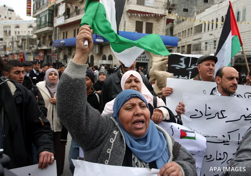 Palestinians demonstrate in solidarity with Khader Adnan, a senior member of Islamic Jihad jailed in Israel, who has been on a hunger strike for over seven weeks, during a protest in the West Bank city of Ramallah, Tuesd...