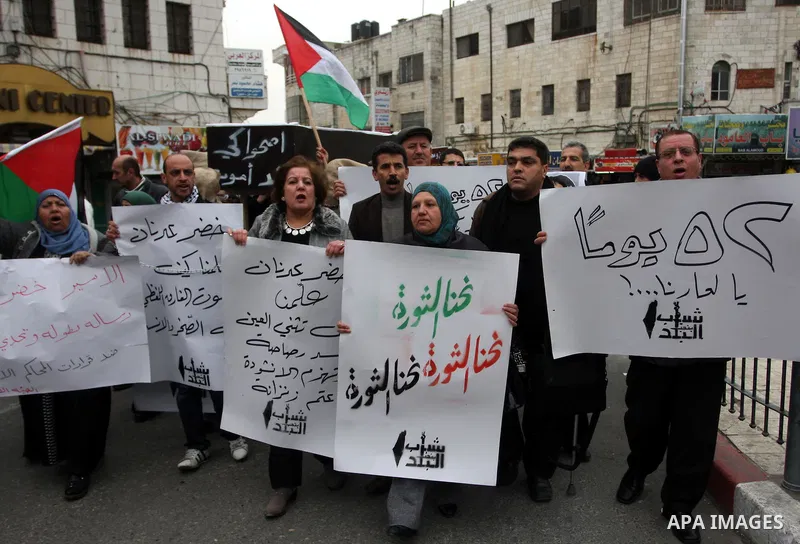 Palestinians demonstrate in solidarity with Khader Adnan, a senior member of Islamic Jihad jailed in Israel, who has been on a hunger strike for over seven weeks, during a protest in the West Bank city of Ramallah, Tuesd...