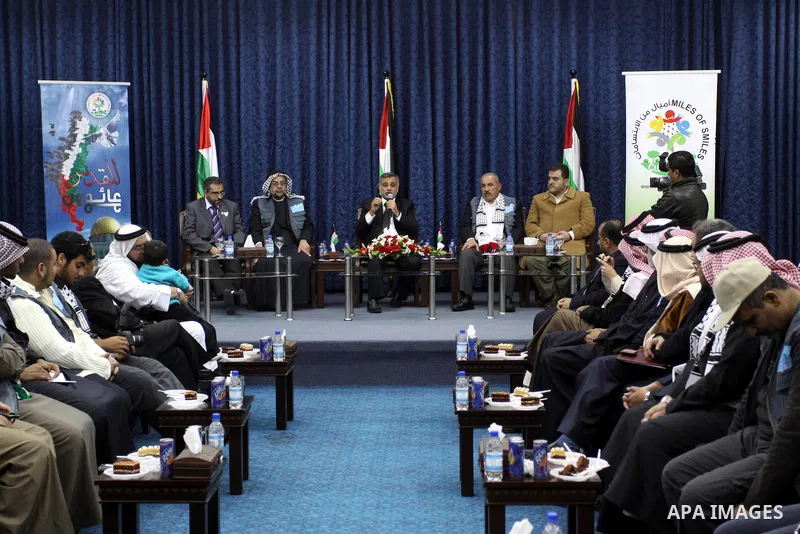 Palestinian Deputy Prime Minister Mohammed Awad receives members of the "Miles of Smiles 9" aid convoy at the parliament headquarters in Gaza city on Feb. 08, 2012. Photo by Mohammed Asad