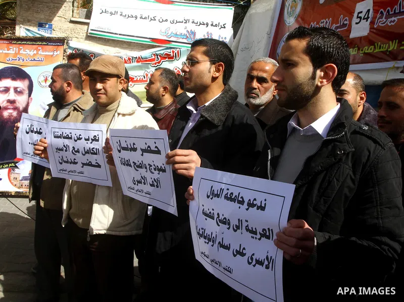 Palestinians protest of prisoner Khader Adnan, who has been on hunger strike since December 18 while being held in an Israeli jail, in Gaza city on Feb. 09, 2012. Photo by Ashraf Amra